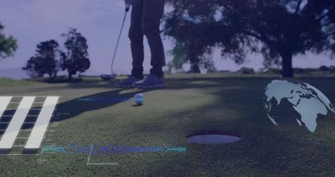 Mature golfer lining up putt on green
