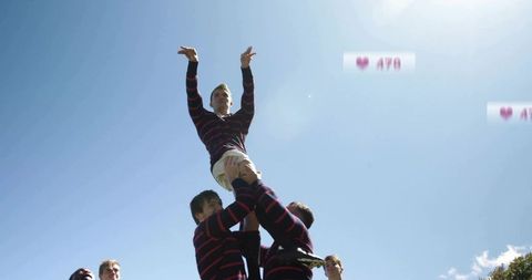Rugby Lineout Players Lifting Teammate Reaching High During Sunny Outdoor Training