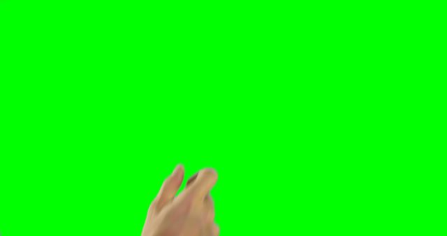 A Caucasian hand is making a snapping gesture against a green screen background, with copy space. Snapping fingers can indicate a sudden idea, a rhythmical cue, or a call for attention in various contexts.