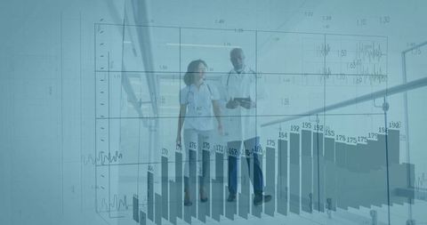 Doctors Analyzing Digital Data with Chart Overlay in Hospital Corridor