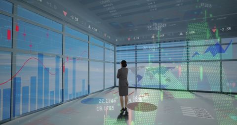 Businesswoman Analyzing Financial Data on Digital Screens