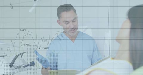 Dentist consulting patient with chart overlay in clinic