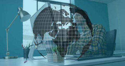 Man in Modern Office Engages in Global Communication