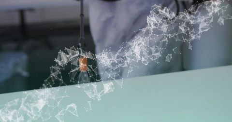 Projecting holographic network above laboratory bench with teal surface and tech overlay
