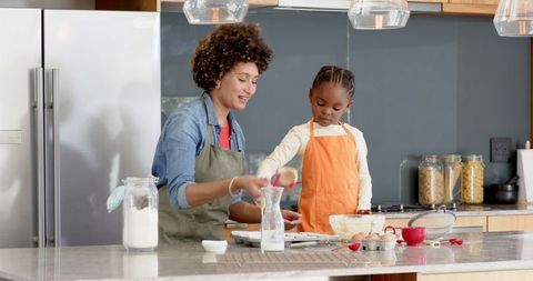 Mother Daughter Baking Duo in Modern Kitchen