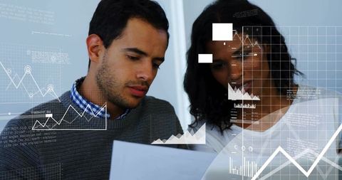Two coworkers reviewing data and charts with digital analytics overlay in modern office