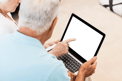 Transparent Concept Senior Couple Using Laptop at Home