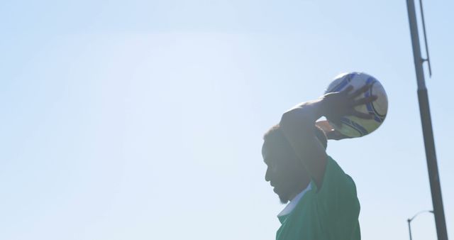 Soccer Player Preparing for Throw-In Against Clear Sky - Download Free Stock Images Pikwizard.com