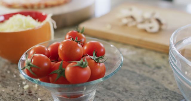 Fresh Cherry Tomatoes in Glass Bowl on Kitchen Counter - Download Free Stock Images Pikwizard.com