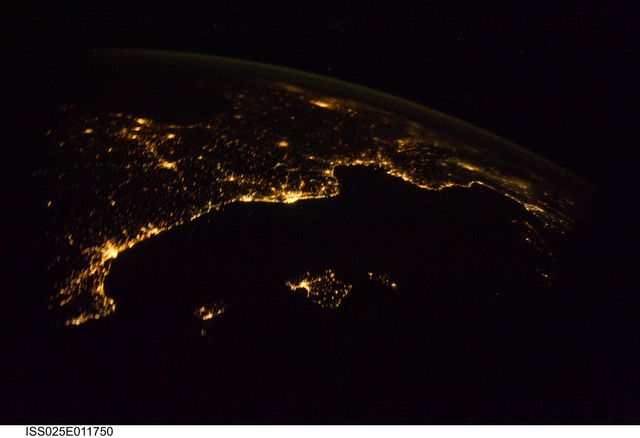 ISS025-E-011750 (4 Nov. 2010)  --- From 220 miles above Earth, one of the Expedition 25 crew members aboard the International Space Station aimed a camera  through a Cupola window and recorded this night time image of the Mediterranean Riviera and a panorama along the coastline from Valencia, Spain to Livorno, Italy and many points in between including parts of Andorra and Monaco.  Islands in the Mediterranean that can easily be delineated in the Nov. 4 picture are the Balearic Islands, as well as Corsica and Sardinia.