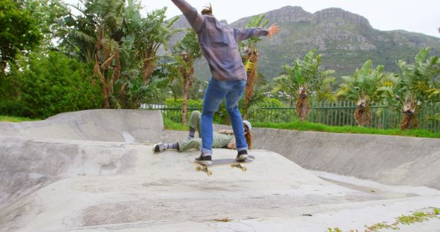 Skater Performing Trick in Skatepark with Nature Background - Download Free Stock Images Pikwizard.com