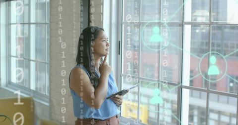 Woman Analyzing Virtual Financial Data in Modern Office