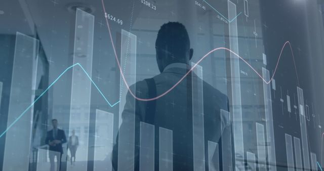 Businessman Analyzing Financial Data with Digital Graphs in Office - Download Free Stock Images Pikwizard.com