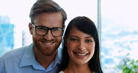 Confident Young Professionals Smiling in Corporate Environment - Download Free Stock Images Pikwizard.com