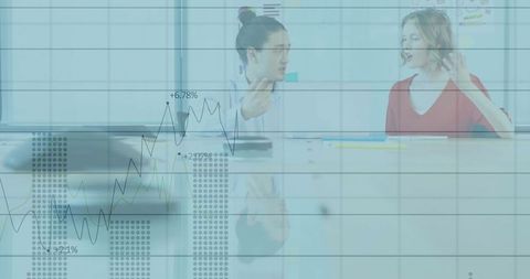 Business Discussion with Financial Charts in Modern Office