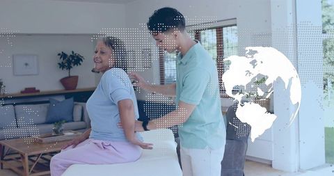 Caregiver Assisting Senior Woman During Home Therapy Session with Global Health Overlay