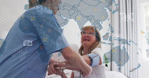 Nurse measuring blood pressure on senior woman with world map healthcare data overlay