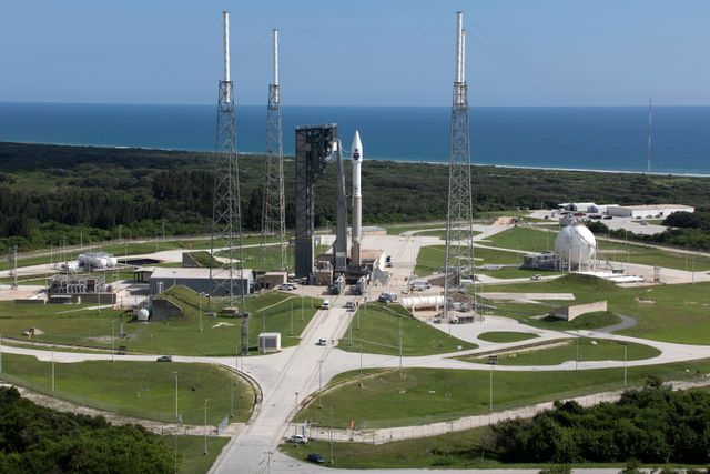 Atlas V rocket stands ready at Space Launch Complex 41, Cape Canaveral, Florida. Ideal for media discussing space exploration, communication satellites, and rocket launches.
