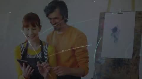 Creative Duo Collaborating on Futuristic Digital Art Project