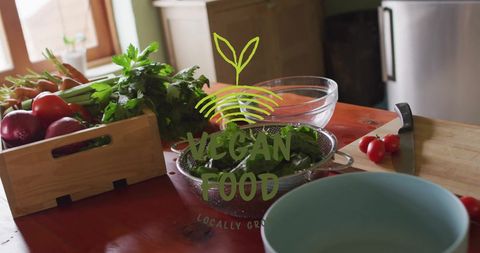 Fresh Organic Vegetables with Vegan Food Label in Kitchen