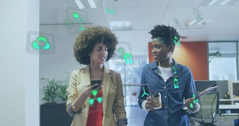 Two colleagues walking and collaborating with augmented reality in modern open office