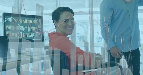 Smiling Colleagues Discussing Data Visualization at Office