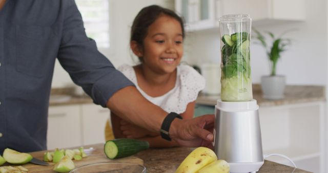 Father and Daughter Preparing Healthy Green Smoothie in Home Kitchen - Download Free Stock Images Pikwizard.com