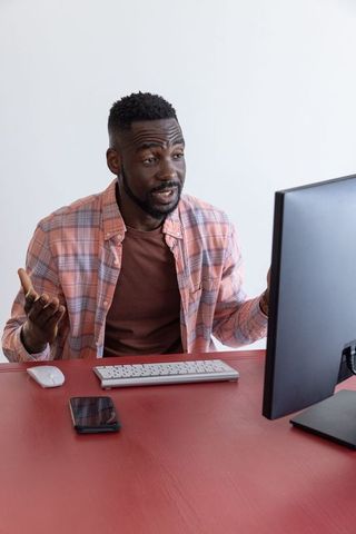 Professional presenting data at modern workspace monitor