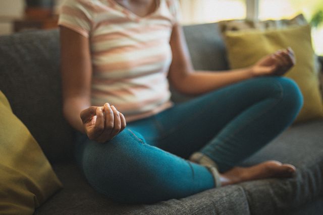 African American Woman Practicing Yoga on Sofa at Home - Download Free Stock Images Pikwizard.com