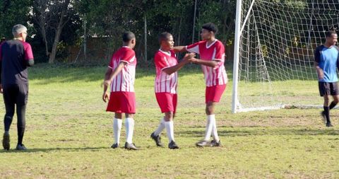 Soccer Team Camaraderie Celebrating Outdoor Victory