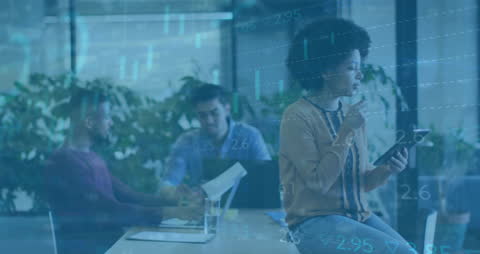 Diverse Team Analyzing Financial Data in Modern Office Ensemble