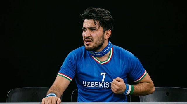 Uzbekistan football fan gripping railing reacting energetically in blue no.7 jersey