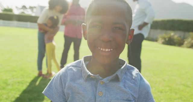 Close-up of Happy African-American Boy with Family at Picnic in Park - Download Free Stock Images Pikwizard.com