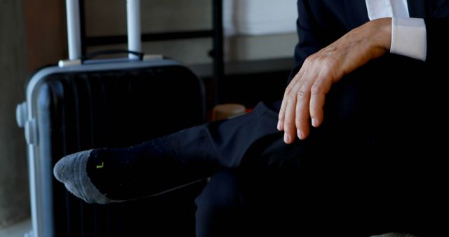 Businessman Relaxing without Shoes Next to Luggage - Download Free Stock Images Pikwizard.com