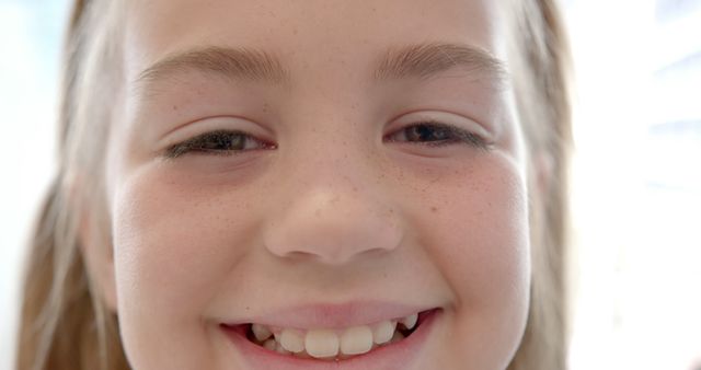 Close-up of Smiling Young Girl with Freckles - Download Free Stock Images Pikwizard.com