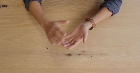 Professional Gestures During Office Meeting on Wooden Desk