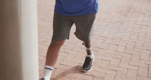 Close-up of Man with Prosthetic Leg Walking Outdoors - Download Free Stock Images Pikwizard.com