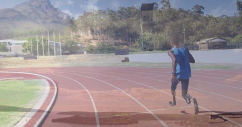 Runner with prosthetic blades sprinting on track