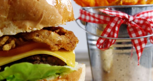 Close-Up of Juicy Cheeseburger and Crispy Sweet Potato Fries in Bucket - Download Free Stock Images Pikwizard.com