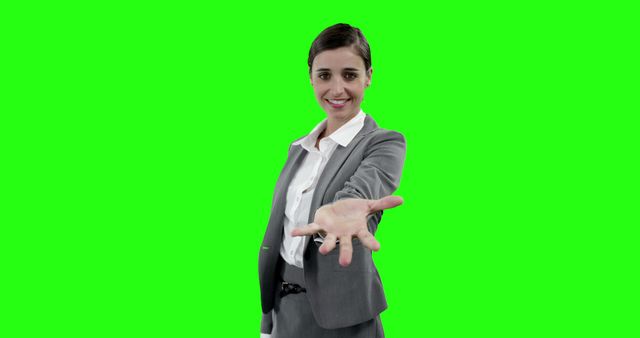 Businesswoman smiling and offering handshake on green screen background - Download Free Stock Images Pikwizard.com