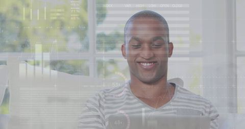 Smiling Man Analyzing Data Projections at Home