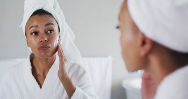 Woman Practicing Skincare Routine in Bathroom Mirror - Download Free Stock Images Pikwizard.com