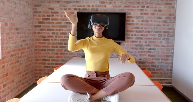 Woman Exploring Virtual Reality Wearing VR Headset in Creative Office Space - Download Free Stock Images Pikwizard.com