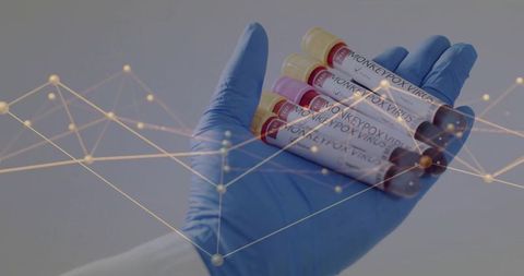 Gloved hand holding labeled monkeypox virus blood tubes with gold data network overlay