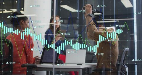 Diverse Team Collaborates on Financial Data Analysis in Modern Office