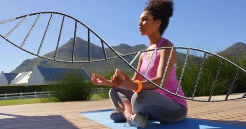 Woman practicing outdoor meditation on deck with dna helix overlay symbolizing wellness