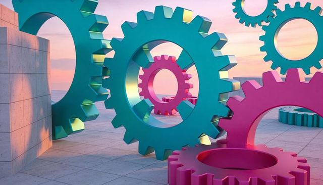 Oversized pastel gears framing coastal plaza sunset, magenta and teal sculptural cogs