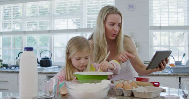 Mother and Daughter Baking Together in Kitchen with Tablet - Download Free Stock Images Pikwizard.com
