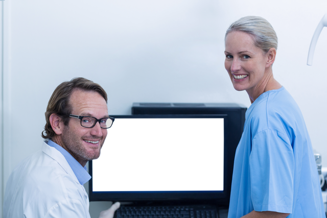 Transparent Smiling Dental Professionals Discussing Xray Results in Dental Clinic - Download Free Stock Videos Pikwizard.com