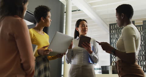 Diverse Businesswomen Collaborating with Technology
